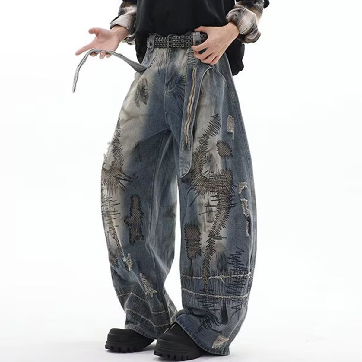 Loose fit blue denim jeans with artistic patch details