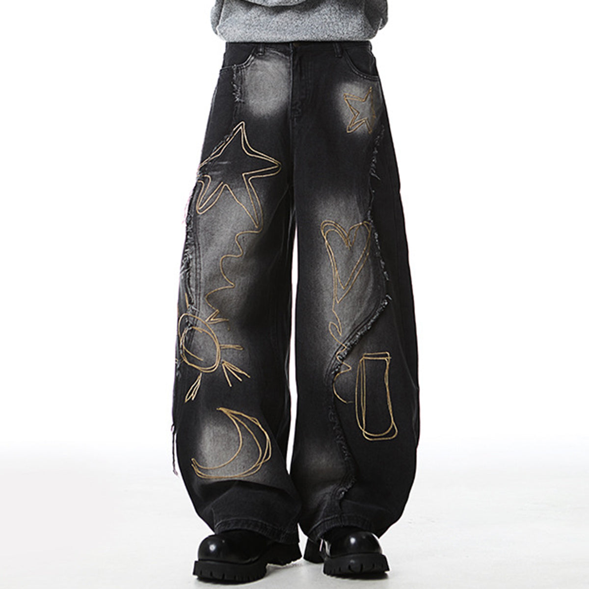Distressed baggy jeans with artistic embroidery details