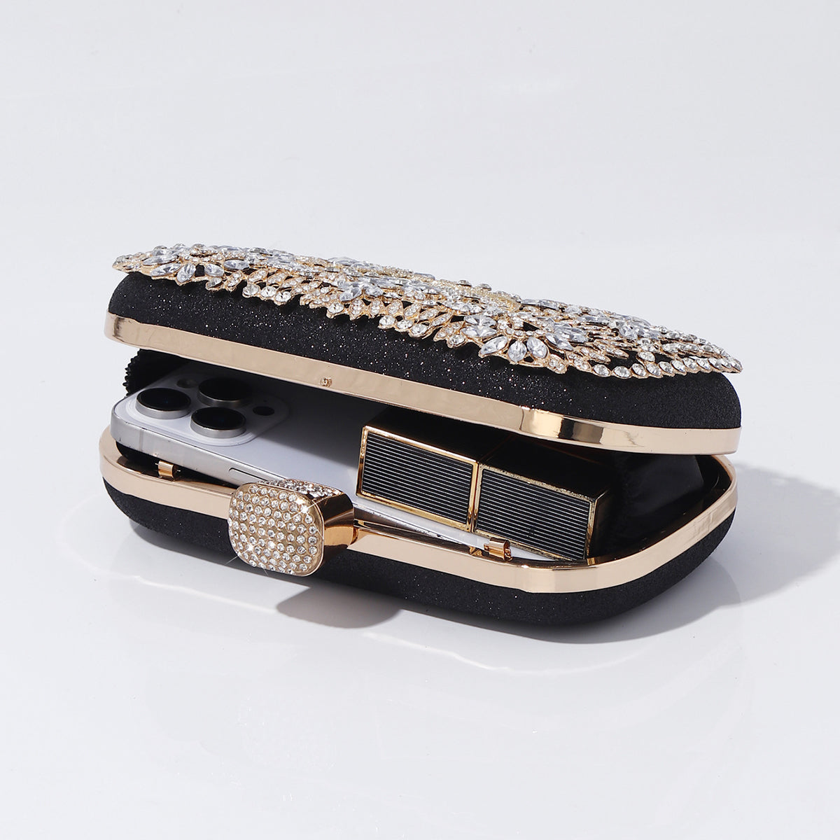 Gold floral crystal evening purse photographed on white background
