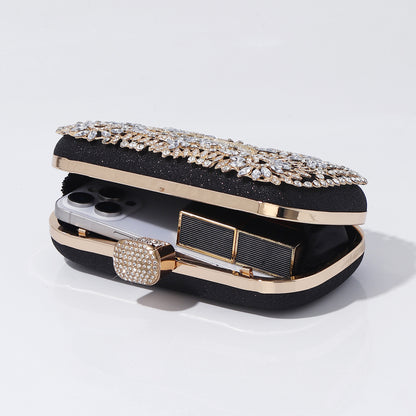 Gold floral crystal evening purse photographed on white background