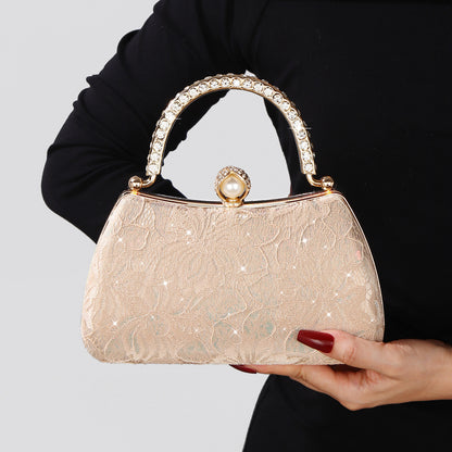 Formal party purse featuring pearl clasp closure