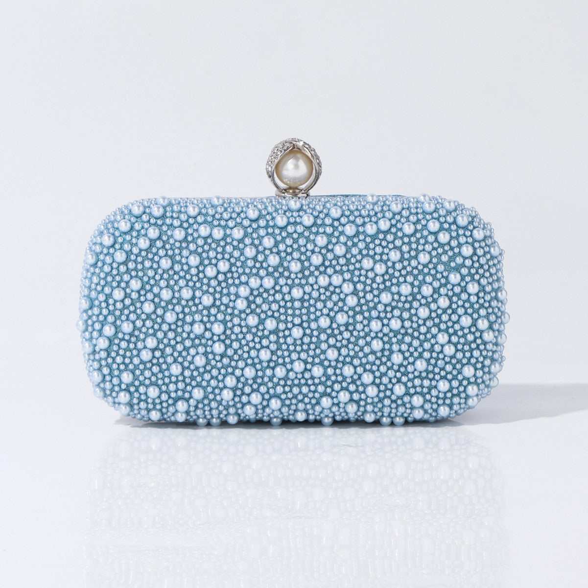 Elegant clutch bag close-up of pearl texture