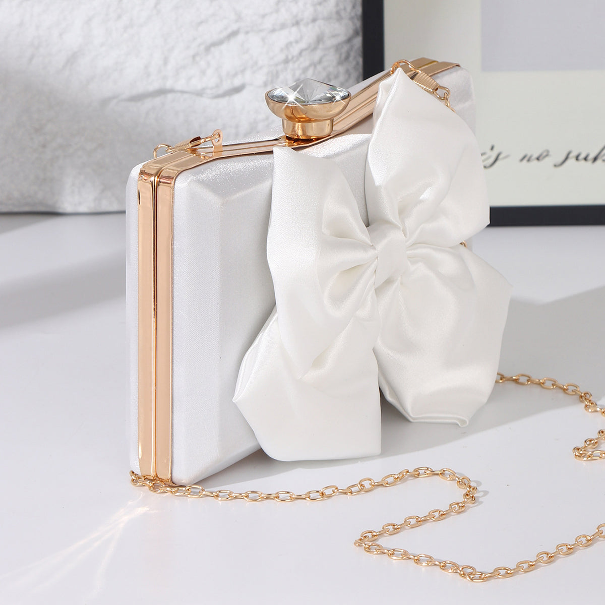 White bridal clutch purse with oversized satin bow