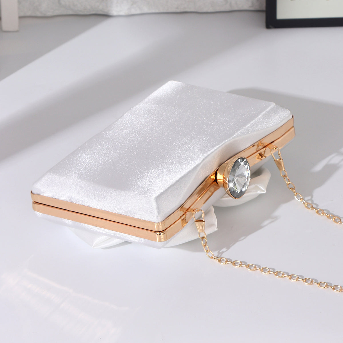 Women's white evening clutch for wedding guests