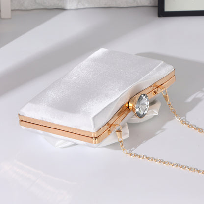 Women's white evening clutch for wedding guests