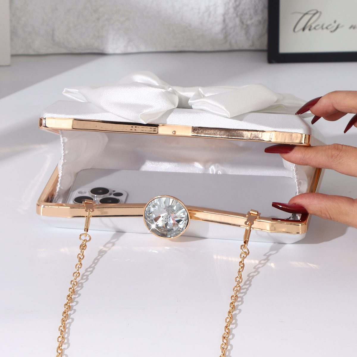 Satin bow evening handbag with crystal clasp
