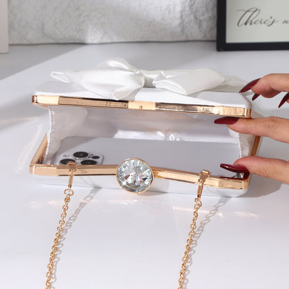 Satin bow evening handbag with crystal clasp