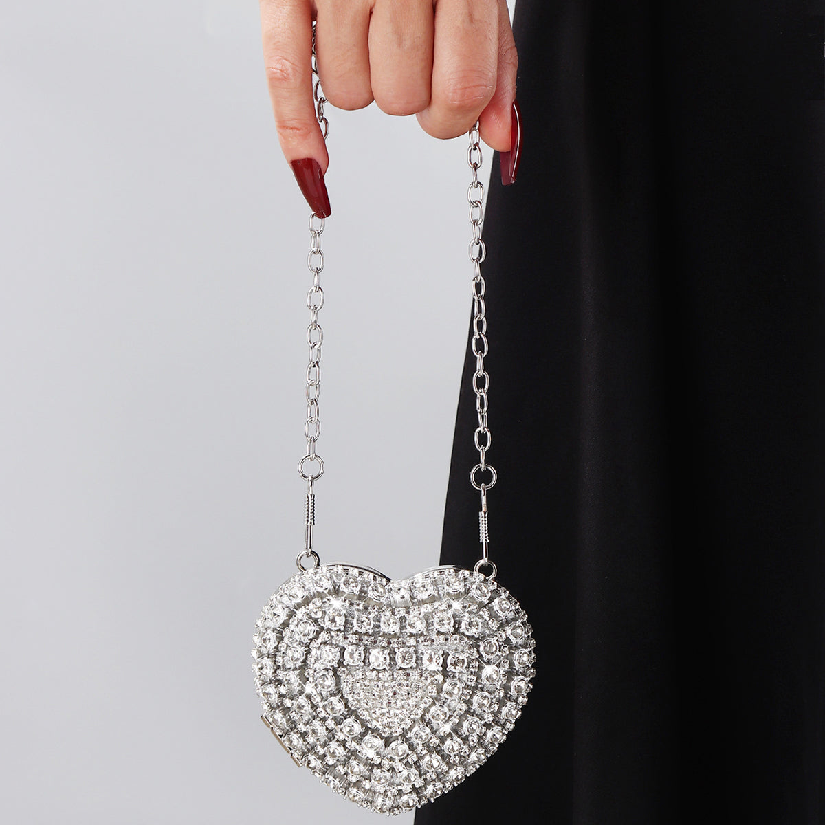 Sparkling crystal heart clutch with silver chain strap