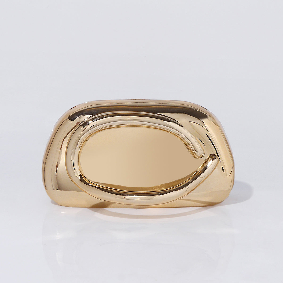 Sculptural gold acrylic clutch bag with detachable chain strap