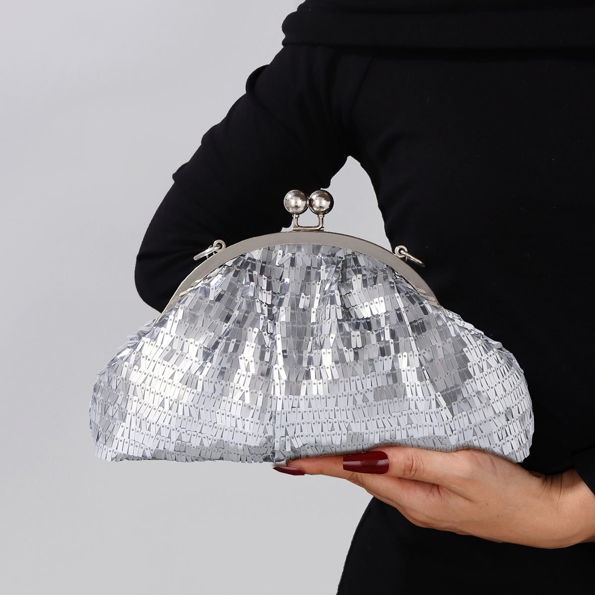 Silver sequin evening clutch with kiss lock closure