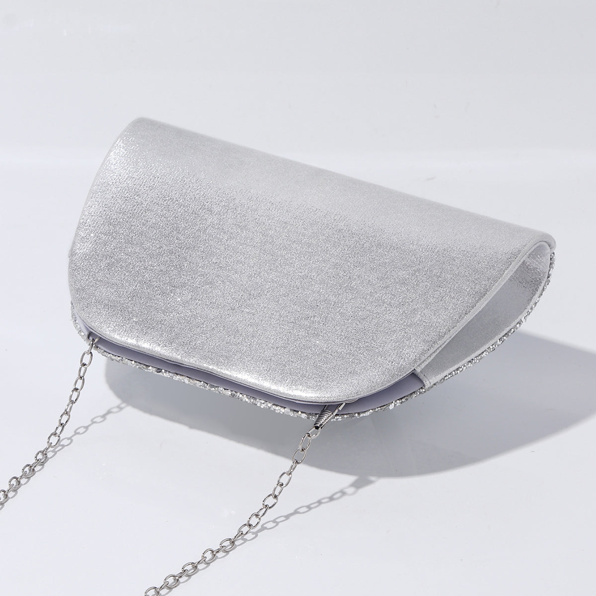 Wedding guest clutch bag with statement handle