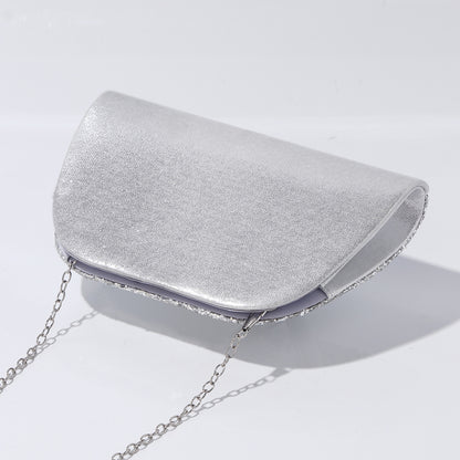 Wedding guest clutch bag with statement handle